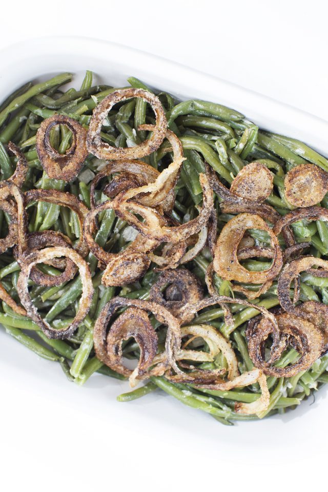 A tender green bean casserole in a light creamy sauce and topped with fried onions, made in a pressure cooker. A holiday recipe that you'll hardly spend time making. Instant Pot or Multi-cooker.