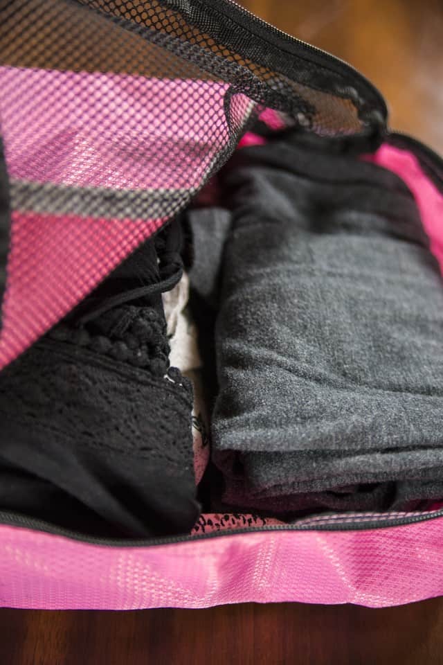 Genius Hacks for Packing Your Carry-On Suitcase - Use packing cubes. I started using packing cubes a few years ago and never looked back. These awesome cubes are basically rectangle bags with zippers that you can place folded clothes into and then zip up.