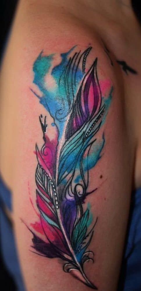 Elaborate watercolor feather tattoo