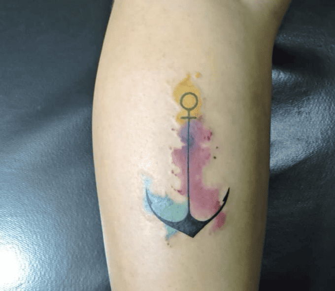 Low-profile watercolor anchor tattoo