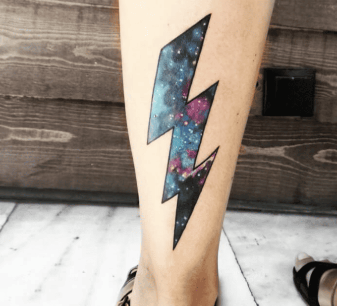 Galactic watercolor lightning bolt tattoo