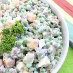 Welp, if May is really here (and it's not some kind of conspiracy), then I suppose I better share a spring recipe. It's one of my potluck and backyard BBQ favorites - Easy Creamy Pea & Cheese Salad. Peas with cubed cheddar cheese, red onions, mozzarella cheese, mayo, and ranch dressing. It's the perfect side dish for your next family party or gathering!