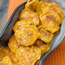A warm cinnamon brown sugar sweet potato chip recipe that you will have a hard time not gobbling up! Perfect for a snack at home or a party with friends, these sweet potato chips are THE BOMB!