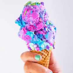 Whether it's in a cone or sundae style, this easy homemade mermaid ice cream cone recipe is full of neon color, sprinkles, and magic that is just perfect for a birthday party or just because you love mermaids.