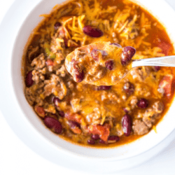 Ground beef, diced tomatoes, bell peppers, kidney beans and a whole lotta spices made this easy (and cheesy) chili recipe made in a pressure cooker is the best in the west.