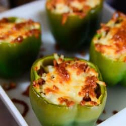 Italian sausage, quinoa, sauteed onions, and parmesan cheese stuffed inside of a fresh green bell pepper and topped with mozzarella cheese. A simple dinner recipe that your entire family will enjoy!